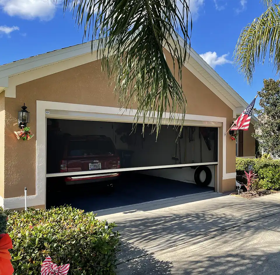 Garage door with automated screen
