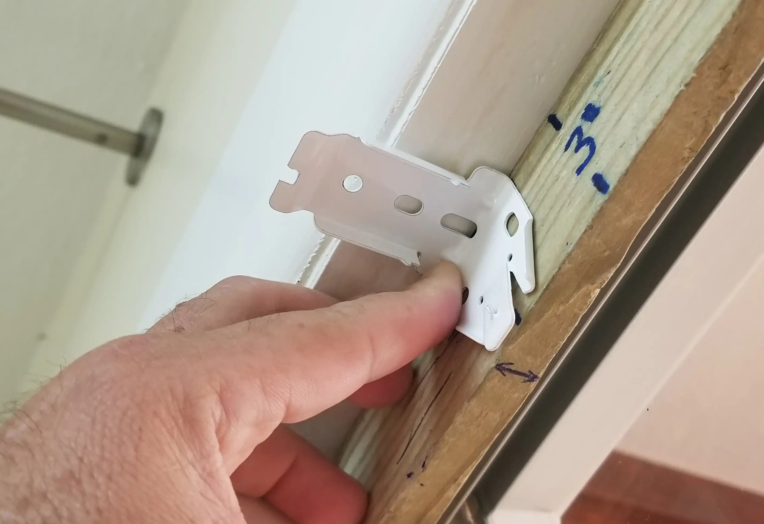 Measuring bracket on window sill
