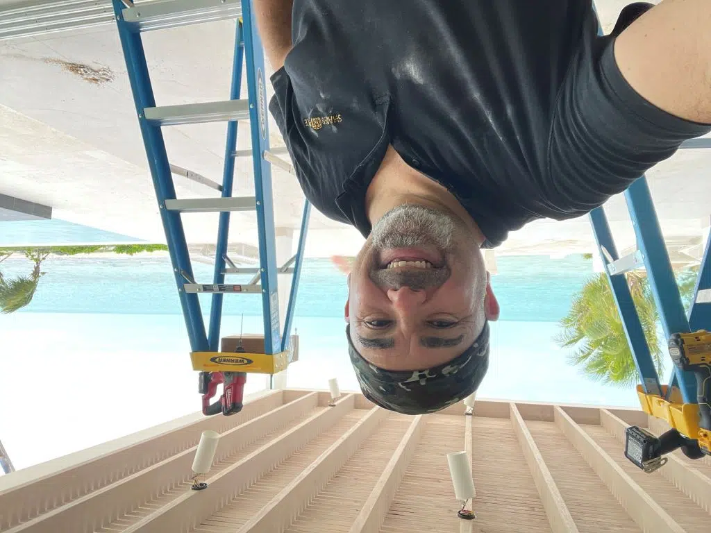 Roger Magalhaes at an installation site in Turks and Caicos