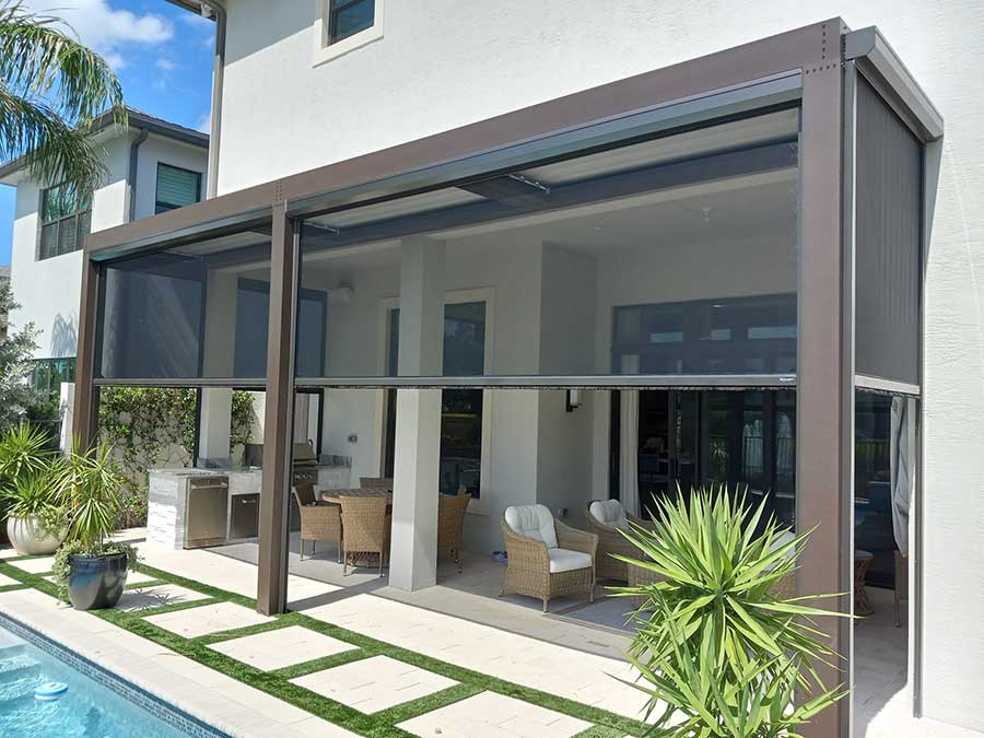 pergola-screen-pool-patio Colonial Shutters against a yellow house