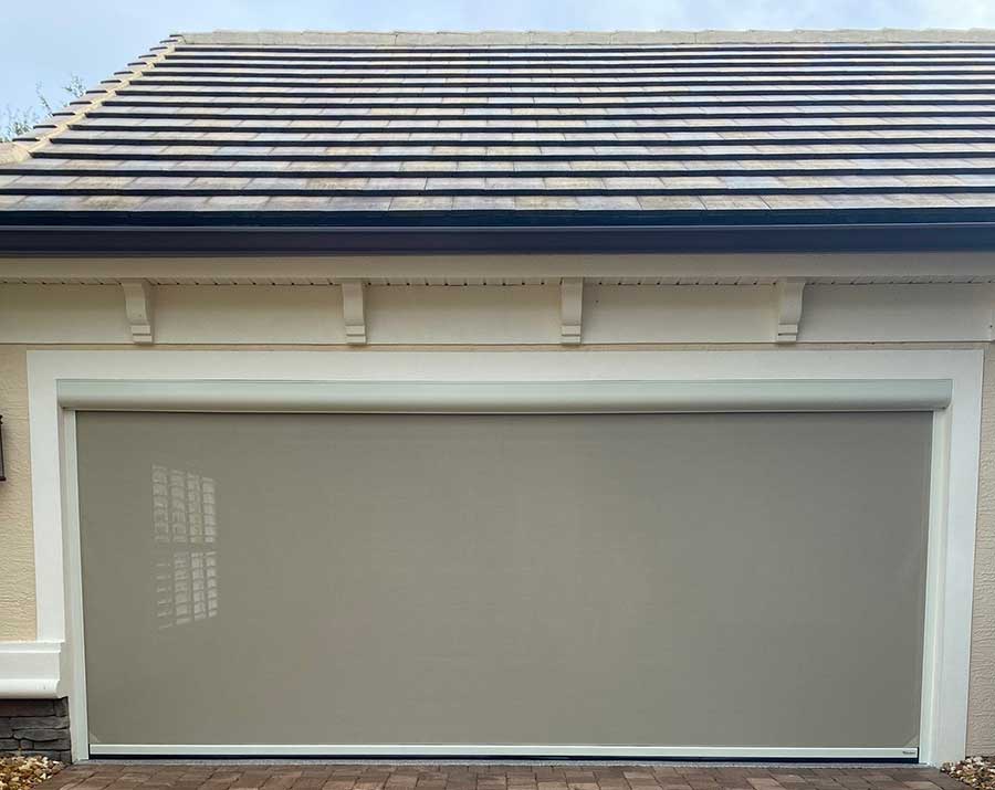 outdoor-pool-house-screens Facing garage door with vinyl screen down